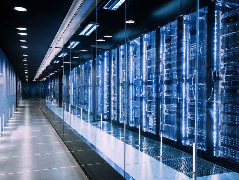 Long hallway of servers, glowing in the dark